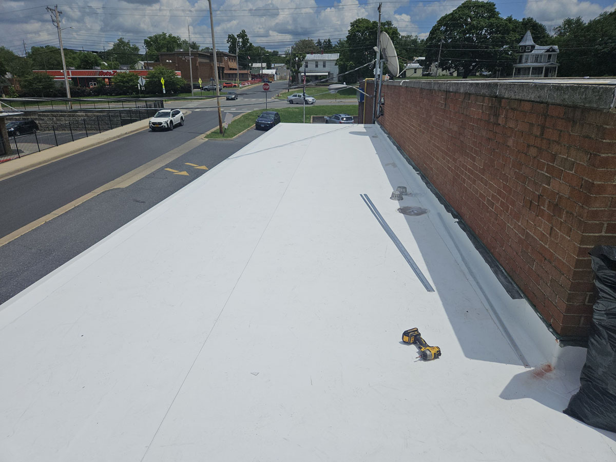 New Elevate UltraPly 60-mil TPO membrane installed on Roof 2 at 150 E Wolfe St in Harrisonburg, Virginia