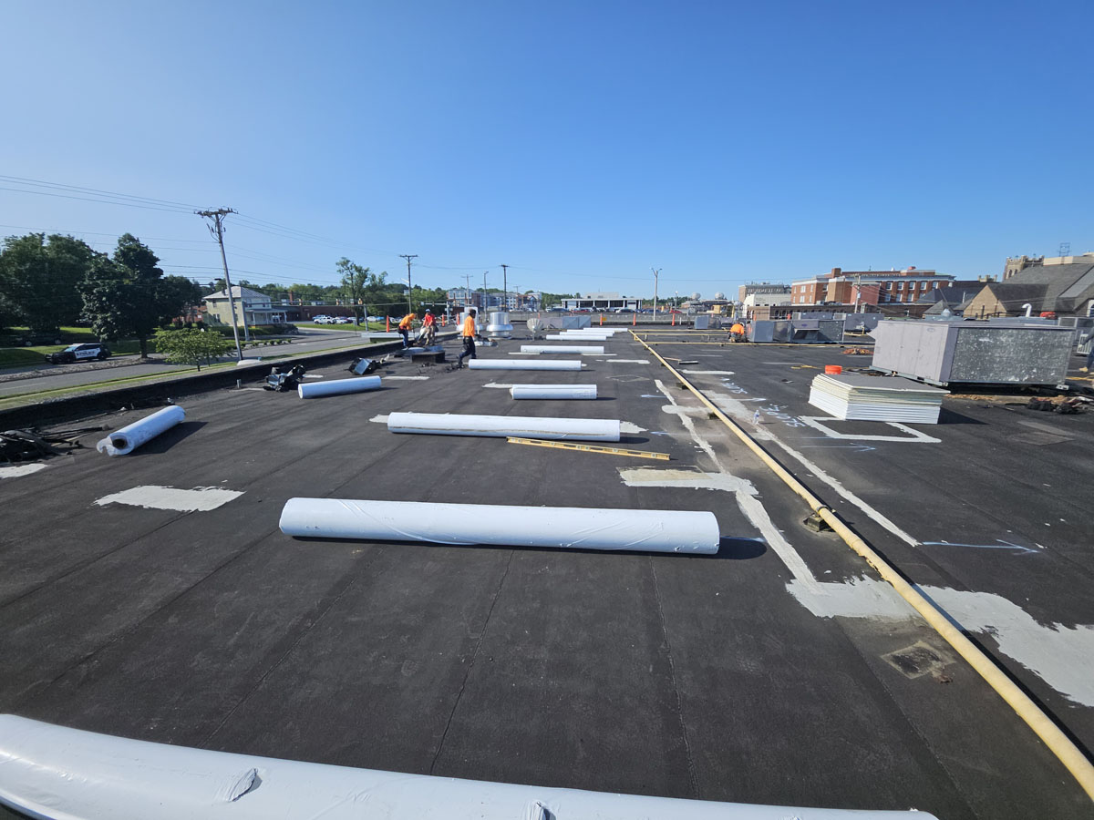 Elevate UltraPly 60-mil TPO membrane being installed over new polyisocyanurate insulation on Roof 1 at 150 E Wolfe St