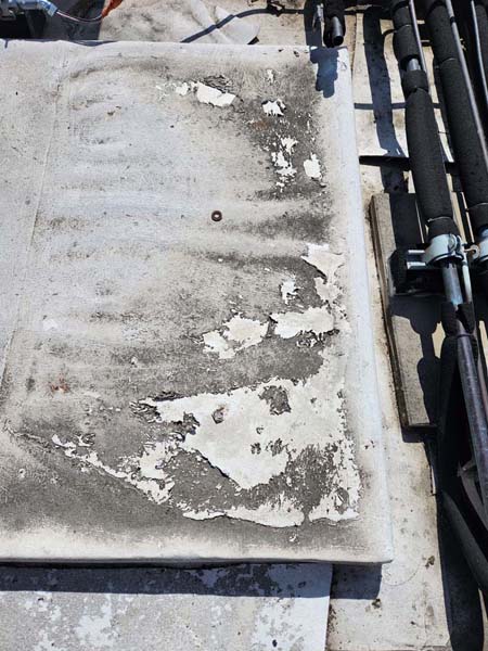 Failing Duro-Last roof membrane at 633 Pennsylvania Ave NW before TPO roof replacement