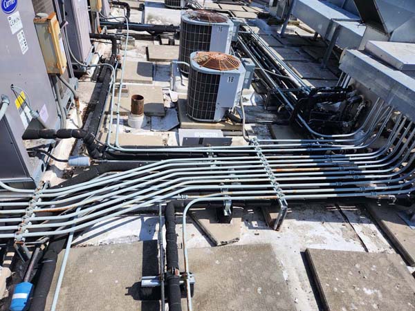 Rooftop HVAC equipment at 633 Pennsylvania Ave NW before lifting and TPO installation