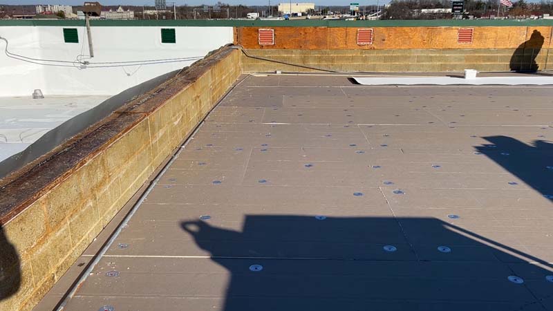 New plywood installed on the parapet walls at 7171 New Market Ct in preparation for TPO flashing