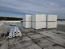Roofing materials staged on the roof at 7171 New Market Ct ahead of the day's installation